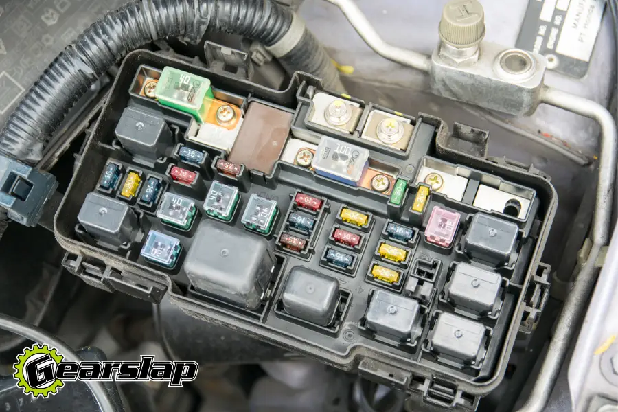 Automotive fuse box with fuses and relays