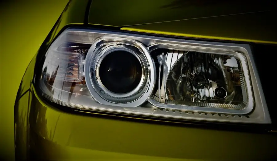 tinted headlights on a yellow car