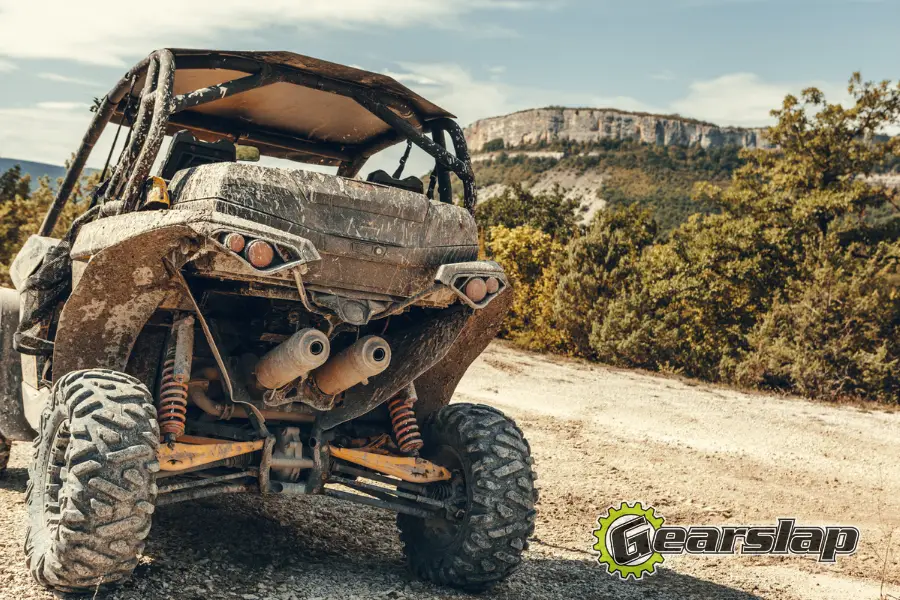 backend of a utv atv quad racer in mud 900x600 1