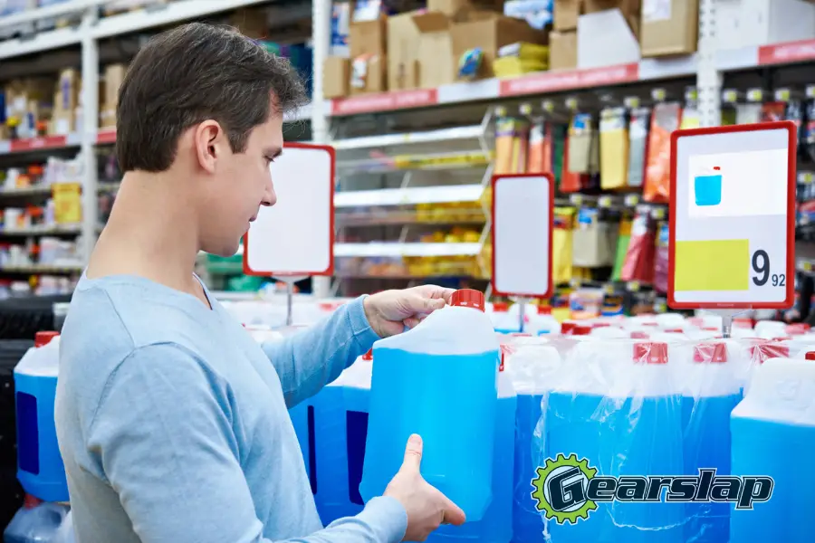 man checking expired automotive car coolant