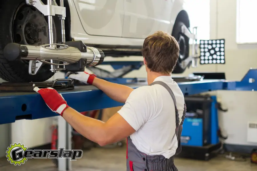 mechanic doing an alignment when do you need one 900x600 1