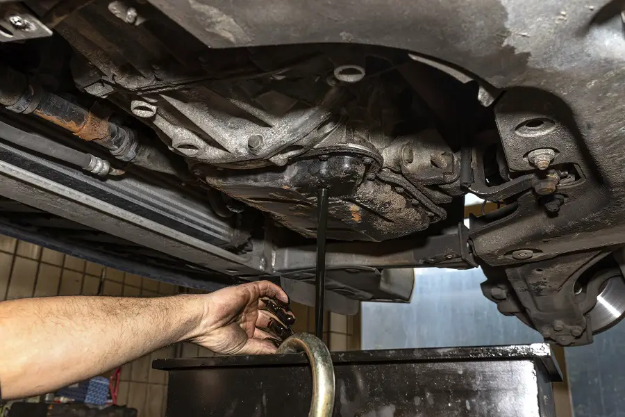 mechanic doing an oil change used oil disposal